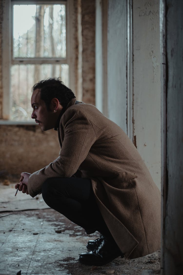 Puzzled Man In Abandoned Building