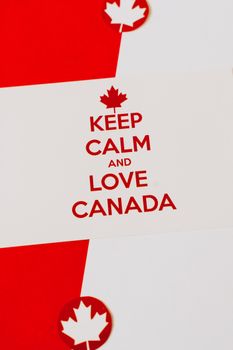 Minimalist poster with Keep Calm and Love Canada message featuring maple leaves.