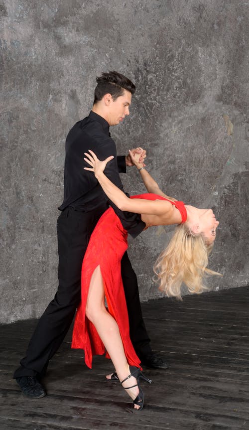 Full Shot of a Man and Woman Dancing Together
