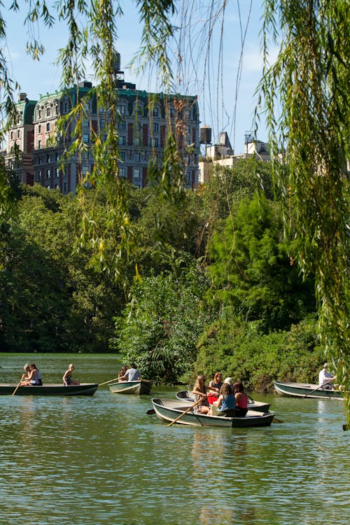 People Riding on Boat on River