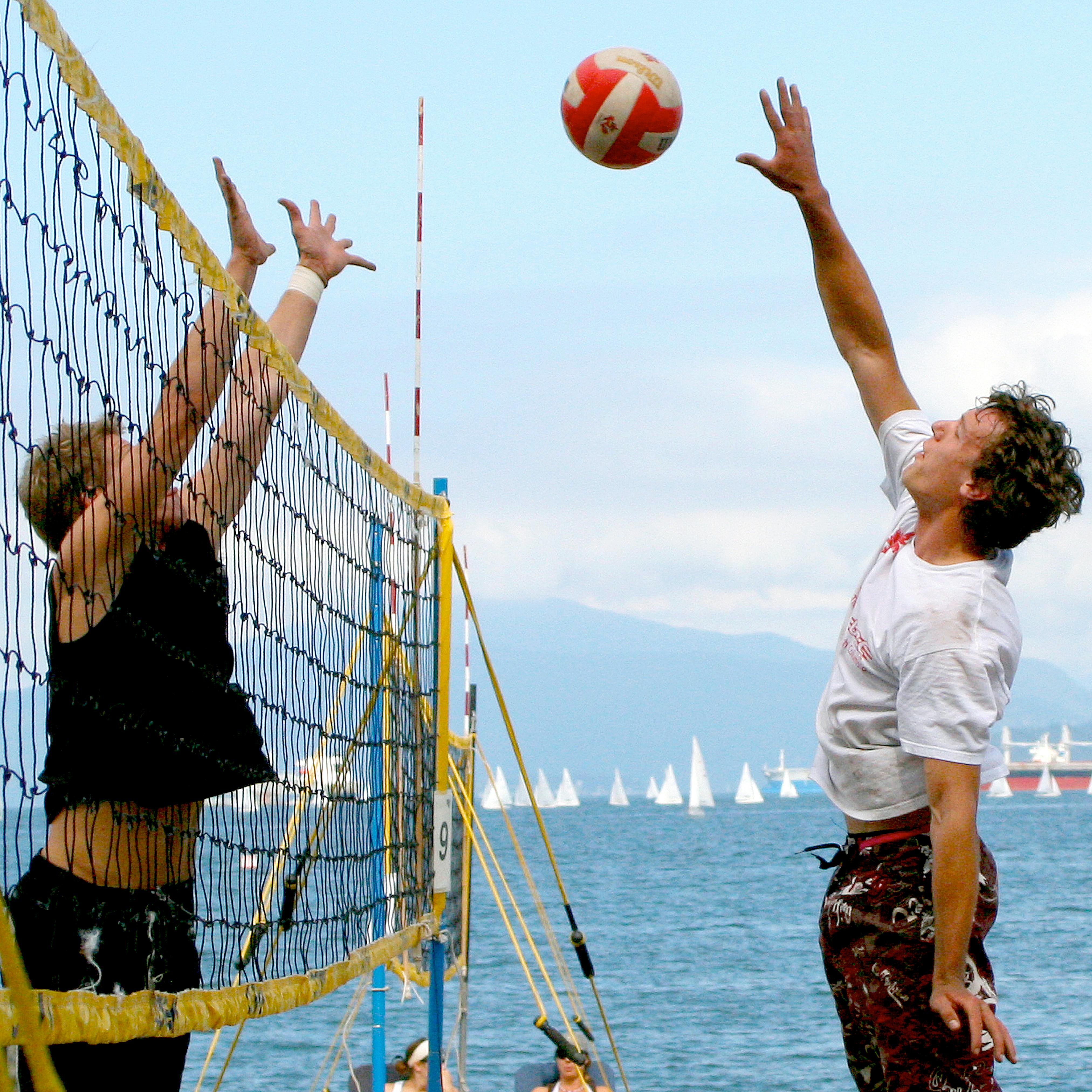 photo of men playing volleyball