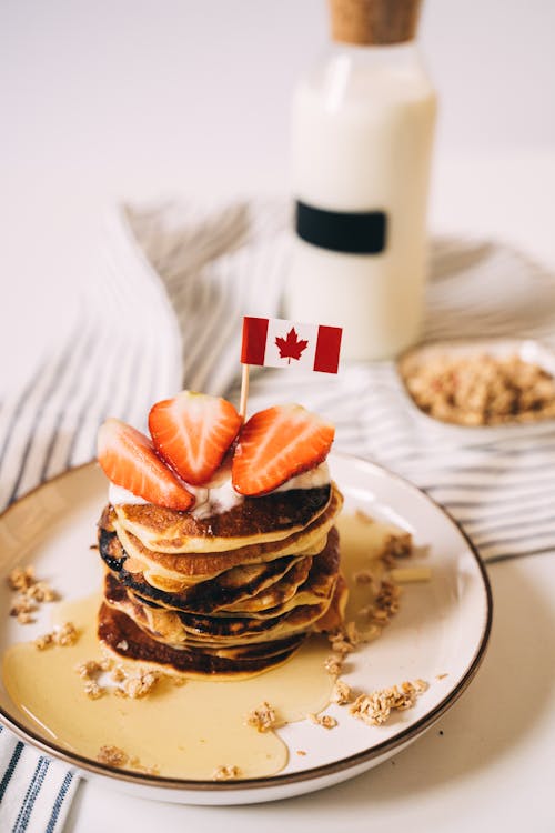 Close-Up Photo of Pancakes with Pancakes with Slices of Strawberries