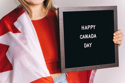 Woman Holding a Letter Board