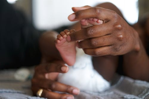 Free stock photo of african american family, baby feet, black family Stock Photo