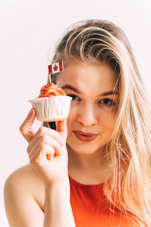 Beautiful Woman Holding a Cupcake