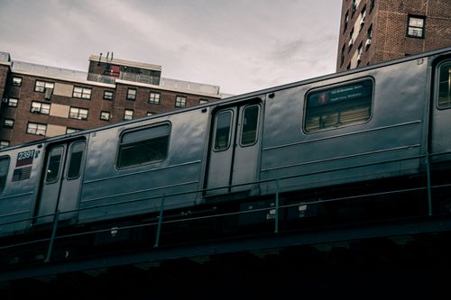 Free Low-angle shot of an elevated train in a cityscape, capturing urban transit. Stock Photo