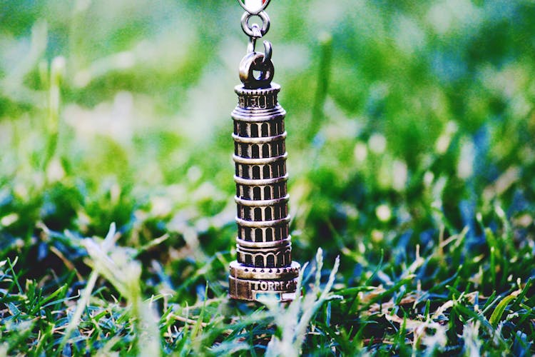 Leaning Tower Of Pisa Pendant On Green Grass At Daytime