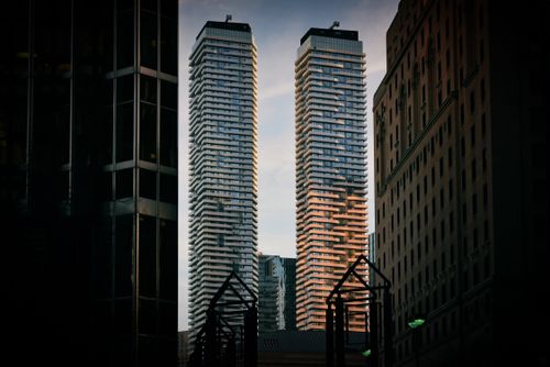 Free Capture of modern skyscrapers against a twilight sky, showcasing urban architectural beauty. Stock Photo