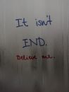 It Isnt End inscription on wet surface