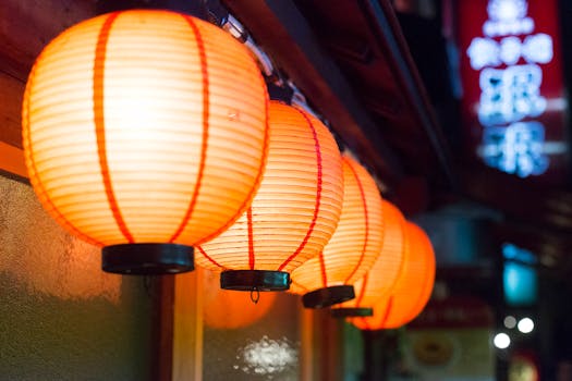 Close-up of illuminated Japanese paper lanterns in an outdoor setting in Nagawa, Nagano, Japan.