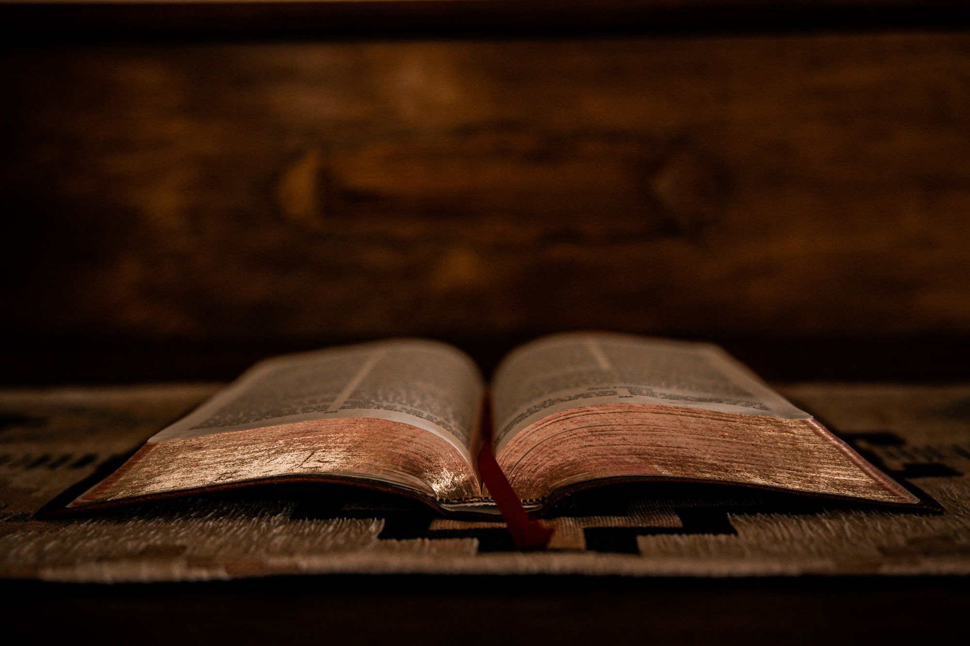 An open Bible with soft golden light