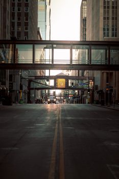 Dramatic sunset view of Minneapolis cityscape, highlighting skyscrapers and skyways.