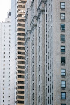 A detailed view of modern high-rise buildings with geometric patterns and diverse textures.