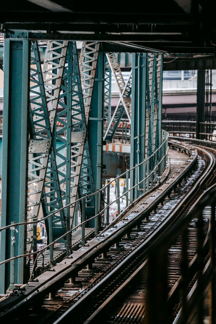 Metal Suspension Bridge With Railway In Modern Megapolis