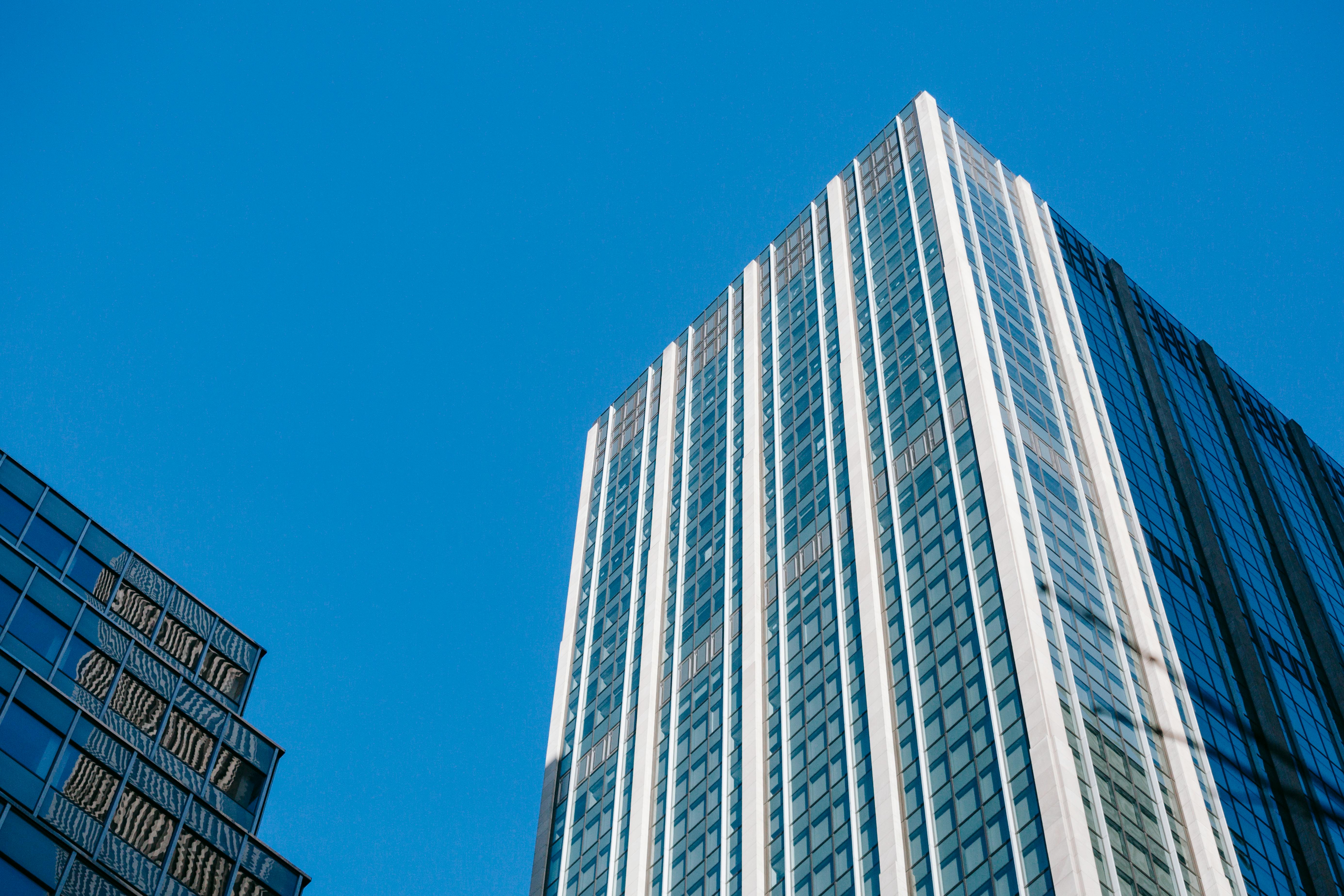 glass skyscrapers under cloudless bright blue sky