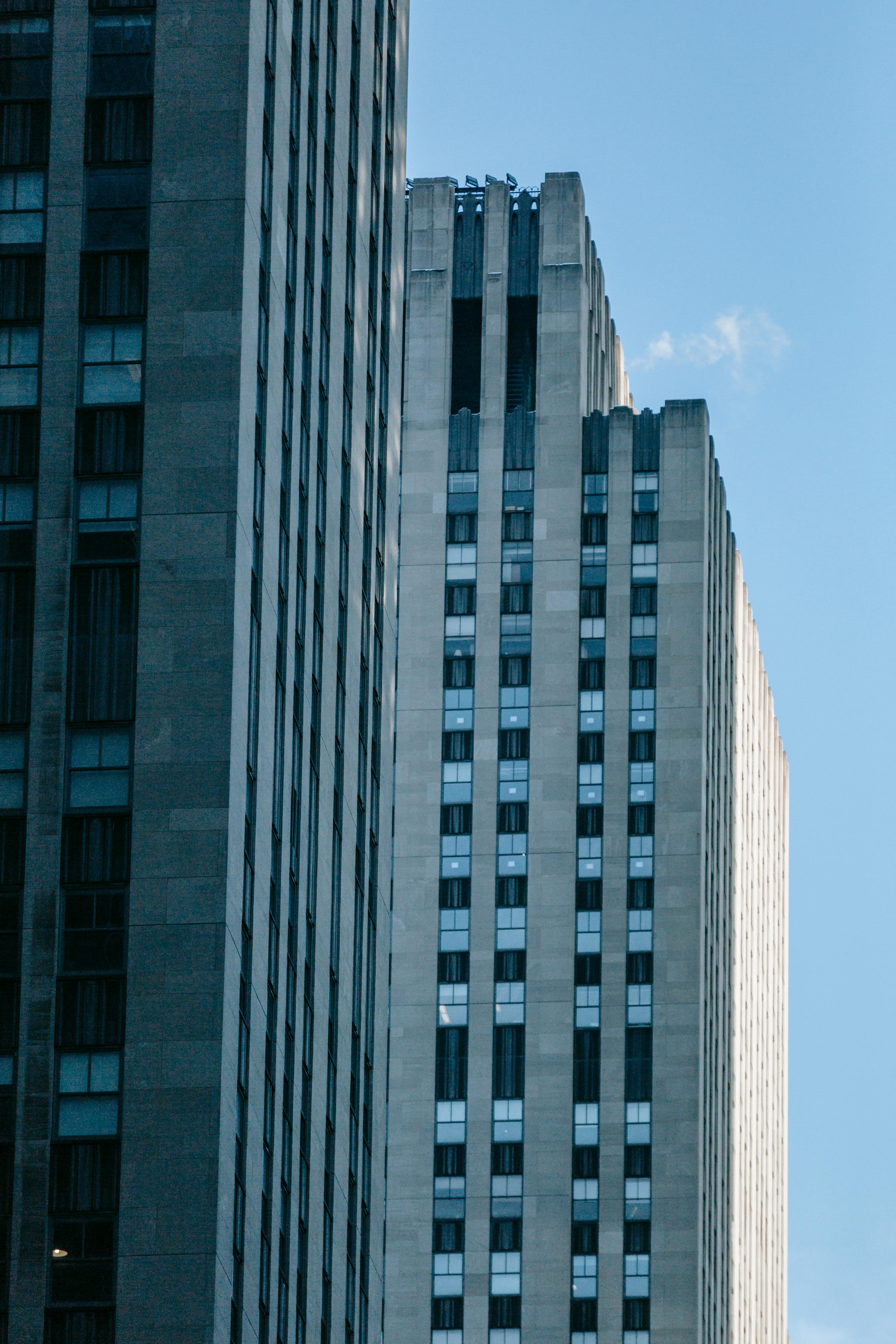 tall modern gray building under blue sunny sky
