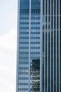 Modern glass skyscraper against blue sky