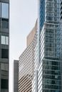 Contemporary multistory building exteriors under light sky in city
