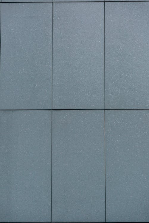 Background of grey wall with rectangles separated by straight thin lines on solid surface
