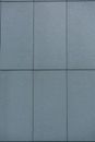 Background of grey wall with rectangles separated by straight thin lines on solid surface