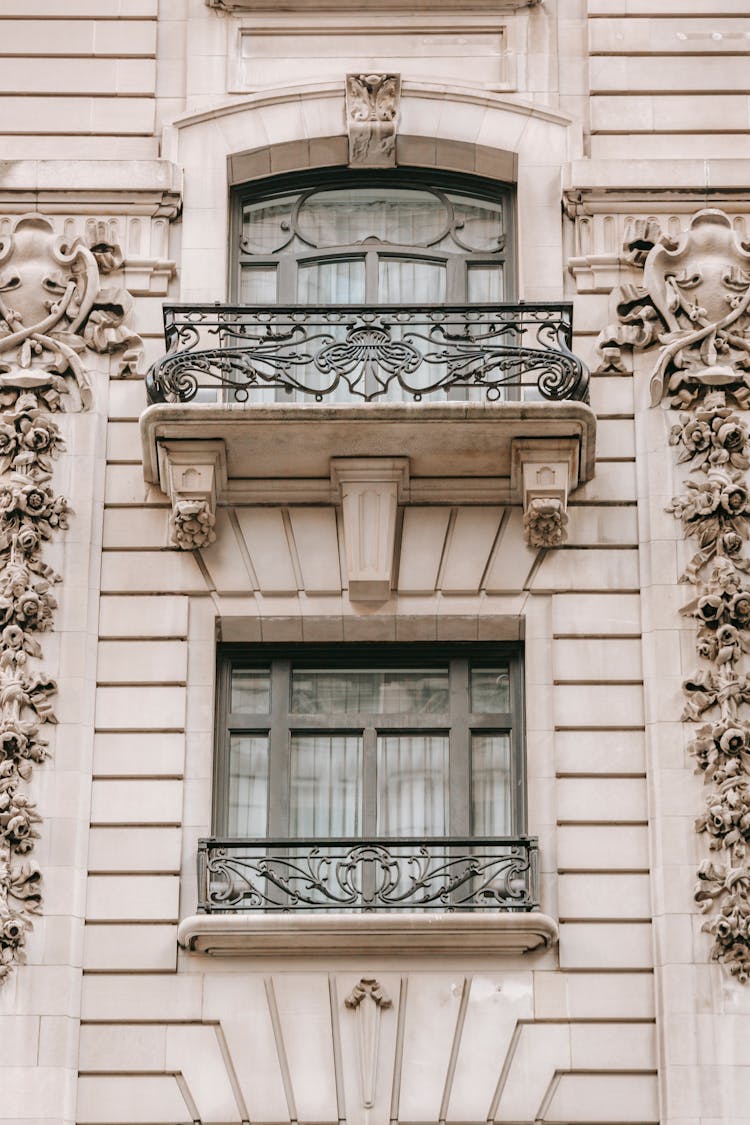 Old House Facade With Decor On Walls In Town