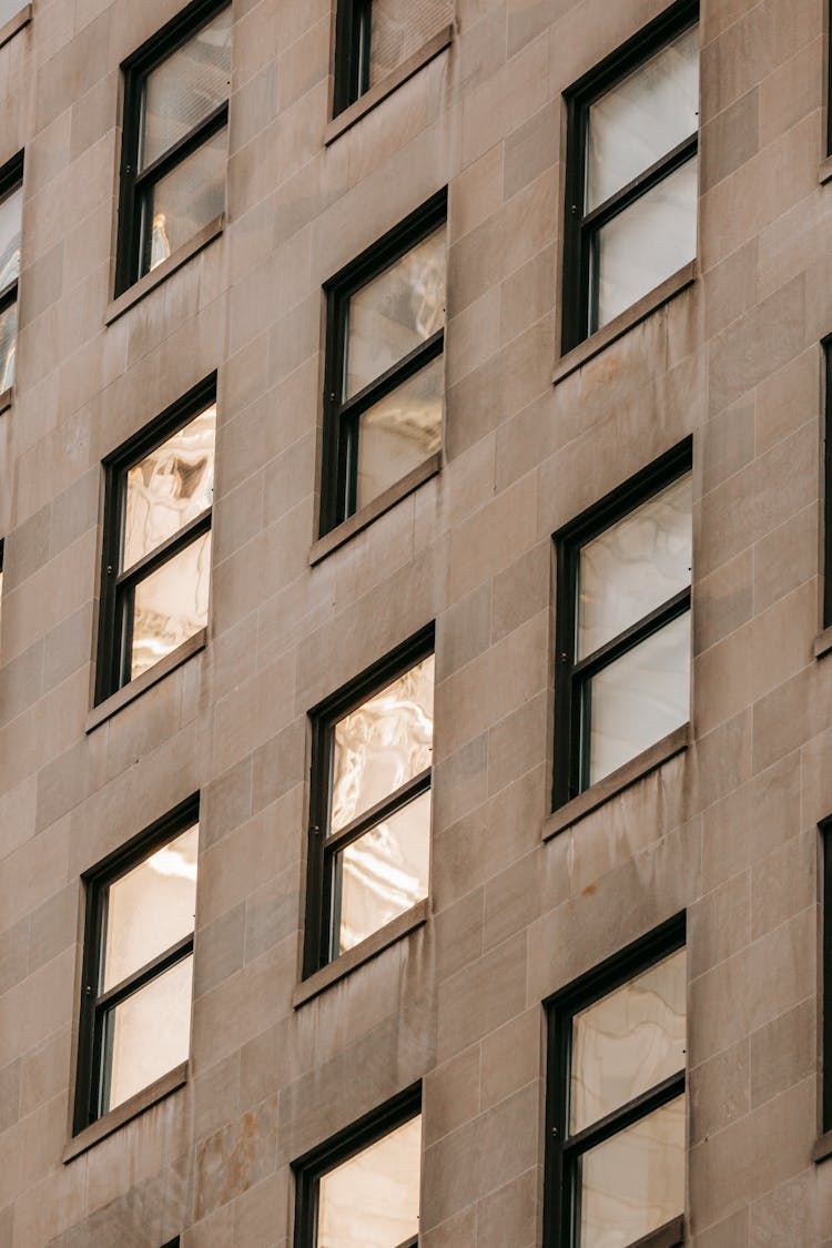 Modern High House Facade With Rows Of Windows In Town