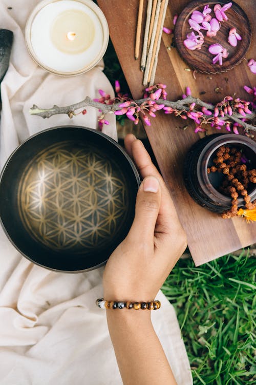 Person Holding a Metal Bowl