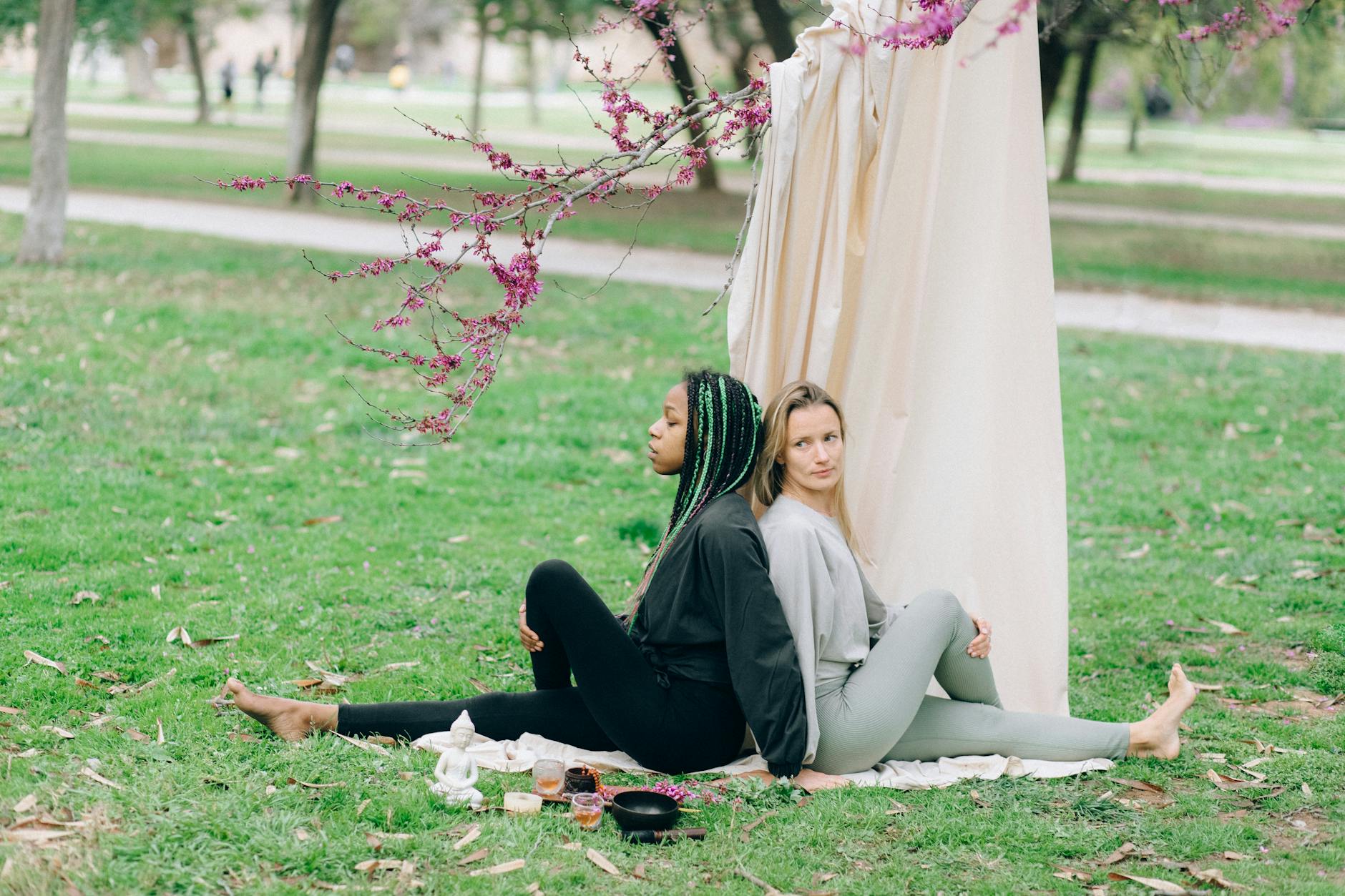 Women Stretching while Back to Back