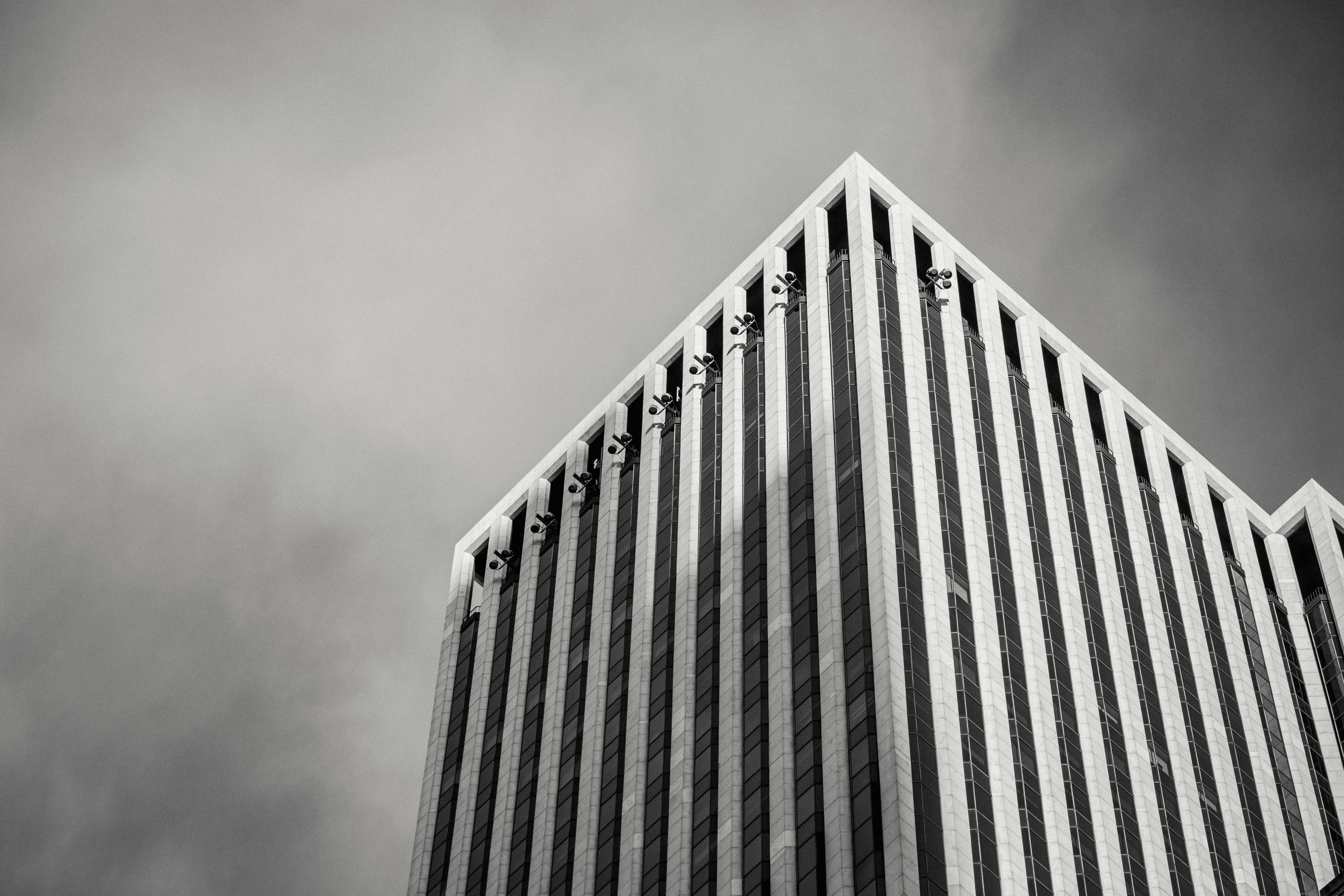 corner of tall financial skyscraper in megalopolis