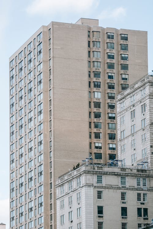 From below of multistory dwelling buildings located in living district in big city