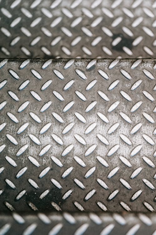 From above of metal background of anti slip steel sheet with uneven texture