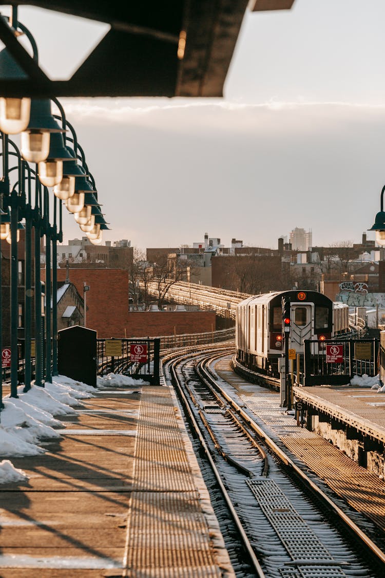 Railroad Station With Train In City