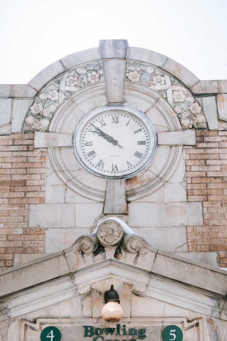 Old Clock On Stone Building Facade