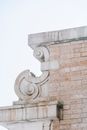Old stone carved on top of brick building