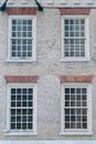 Facade of old residential building with shutters on windows