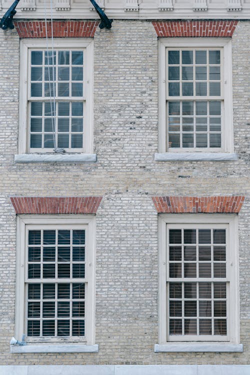 Free Facade of old residential building with shutters on windows Stock Photo