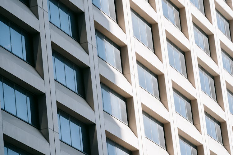 Glass Windows On Modern Building Reflecting Sunlight