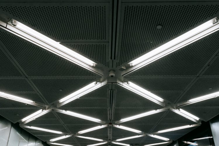 Metal Ceiling With Glowing Lamps In Underground Garage