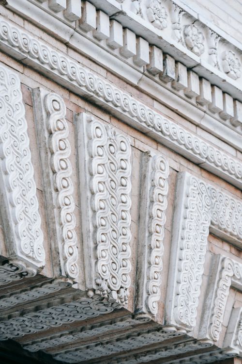 Free Low angle of curvy carved ornaments decorating facade of aged Washington Square Arch located in New York Stock Photo