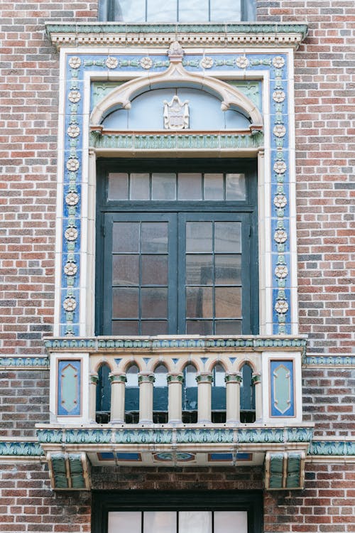 Facade of brick building with ornamental window