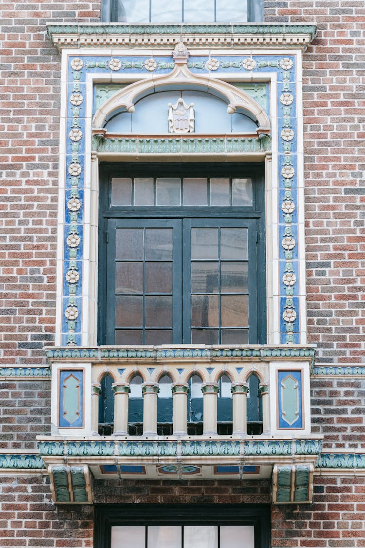 Facade Of Brick Building With Ornamental Window