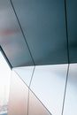 Geometric element of modern steel building with straight lines and angles in daylight