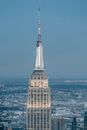 Modern office building with observation decks and spire located in urban core of New York metropolitan area