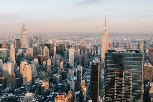A breathtaking aerial view of New York City's skyline showcasing the iconic Empire State Building during a winter day.