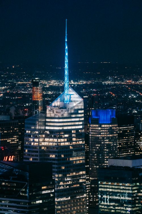 Illuminated skyscraper in night city · Free Stock Photo
