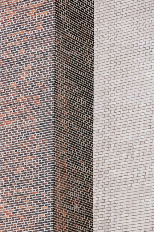 Full frame of angle of brick wall of high rise building in daylight