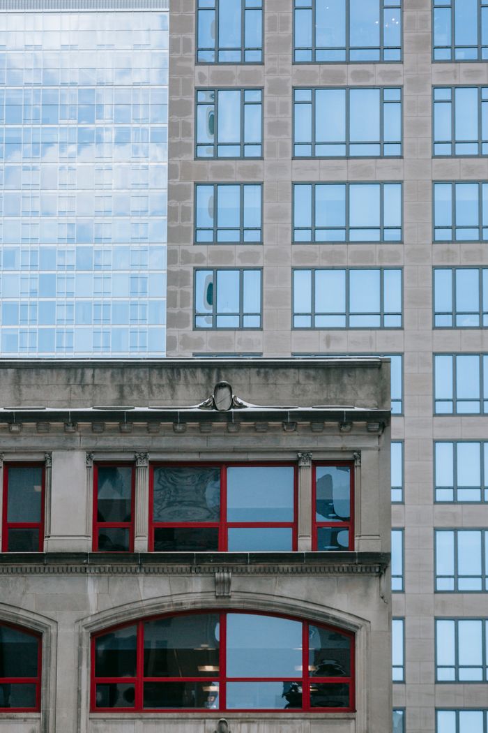 Urban business district facades with rows of windows and glass
