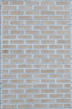 Close-up of a textured brick wall providing a clean, geometric backdrop suitable for various uses.