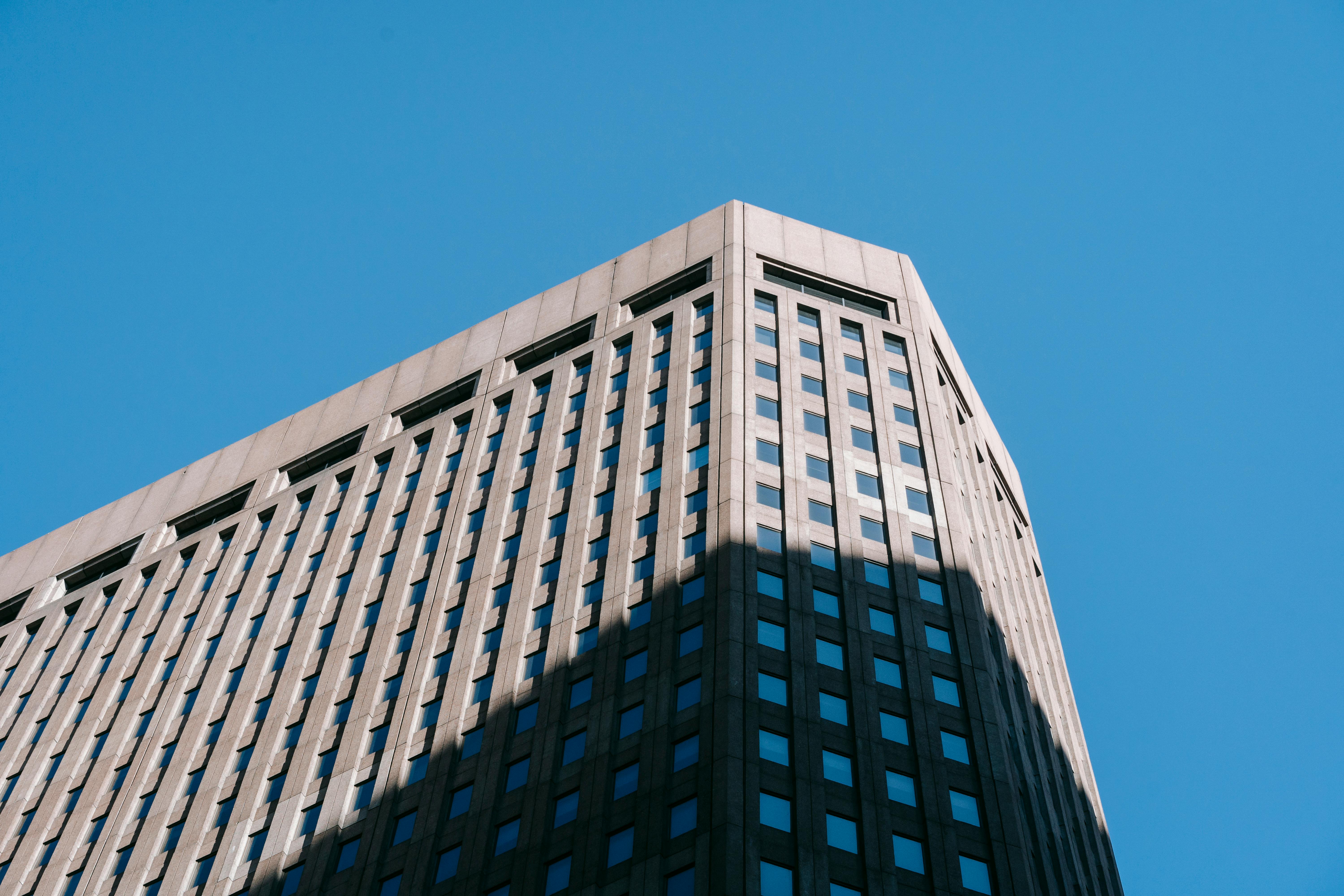 corner of high multistory building against blue sky