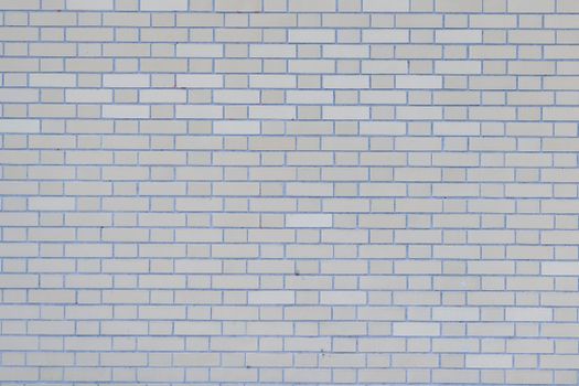 Gray wall with rows of bricks